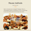 Orange colored silica gel moisture absorber sachets placed in a bowl of mixed nuts and dried fruits