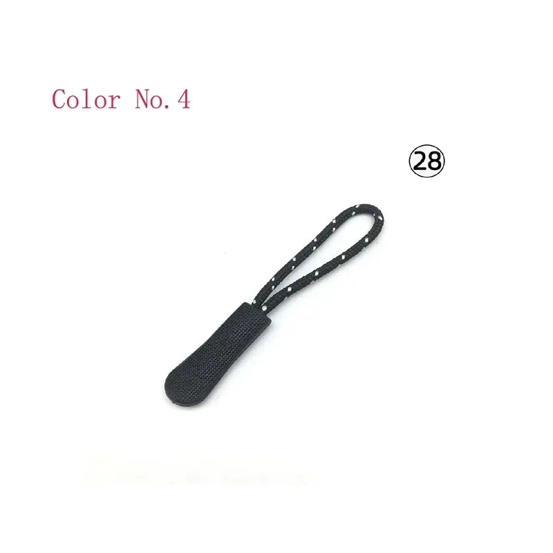 A black plastic zipper pull with a black cord and small white dots, labeled Color No. 4.