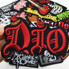 A set of embroidered iron-on patches featuring the acronym DIO in red and black on a black fabric background.