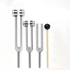 A set of three metal tuning forks with different frequencies 128Hz, 256Hz, and 512Hz displayed vertically.