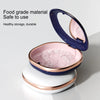 A blue and pink compact orthodontic retainer case with a hinged lid is shown on a white stand.