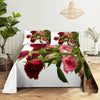 A bedding set featuring a digital print of vibrant red and pink roses on a white background.