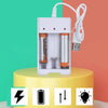 A white USB fast battery charger unit with slots for AA and AAA rechargeable batteries is displayed on a yellow surface.
