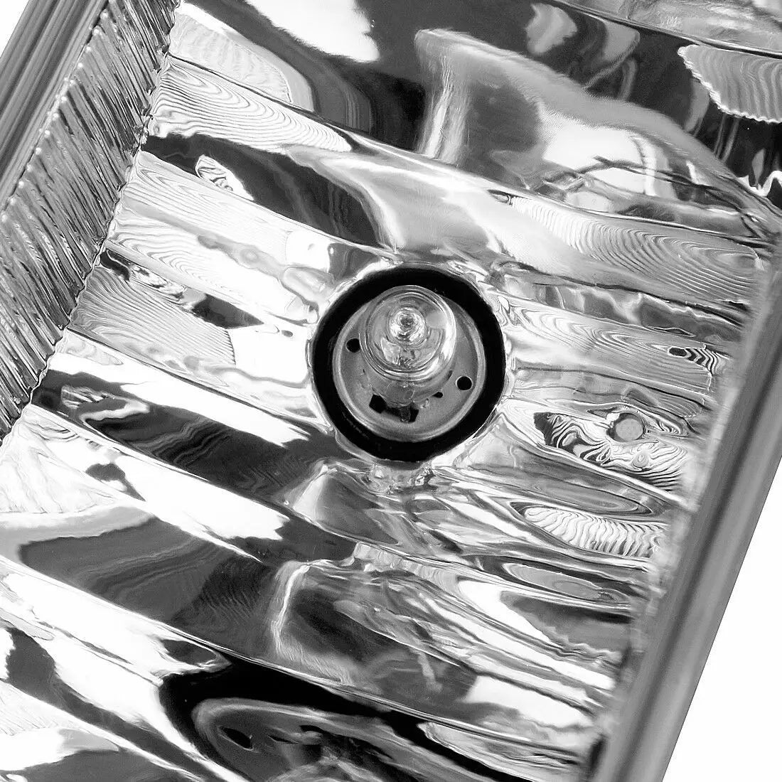 Close-up view of a chrome front bumper fog light assembly for a truck or SUV.