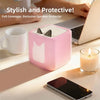 A pink silicone protective cover for a speaker, shown next to a laptop and a cup.