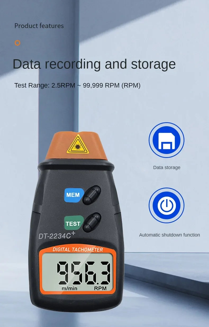A black digital tachometer measuring 956.3 m/min RPM, used for data recording and storage.