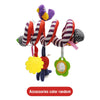 A purple plush toy with striped ribbons and accessories hanging from a green charm.