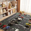 A large gray play mat depicting a car track designed for children in a nursery or playroom.