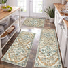 A long, rectangular bohemian non-slip kitchen rug with an intricate floral pattern in beige and blue tones on a wooden floor.