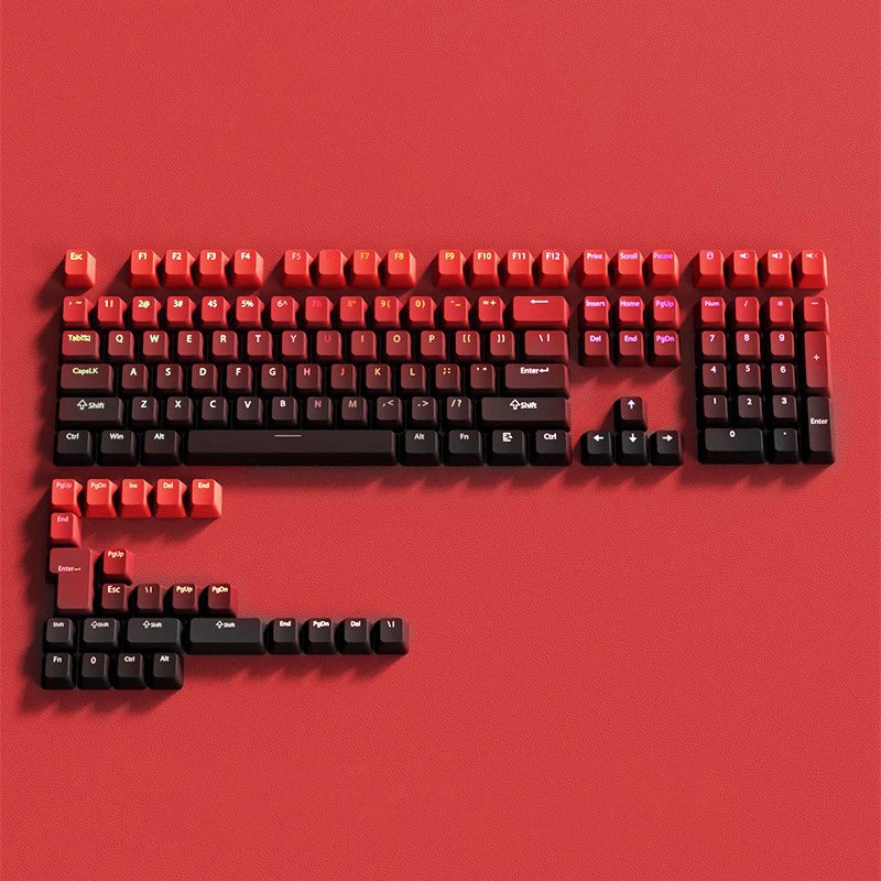 A close-up view of a red PBT double-shot keycap set with gradient colors arranged on a red background.