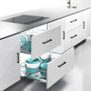 A modern kitchen cabinet featuring matte black stainless steel pulls on white drawers and doors.