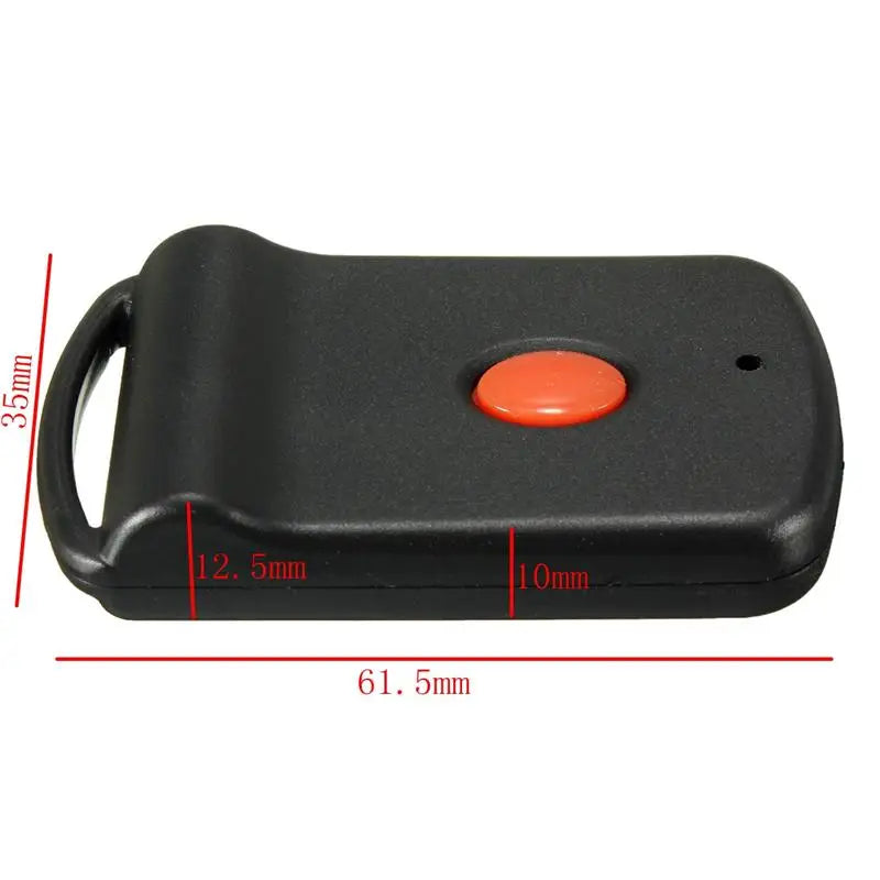 Black universal garage door remote control with an orange button and dip switch programming.