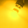 A bright yellow LED bulb illuminating a surface, likely for automotive lighting.