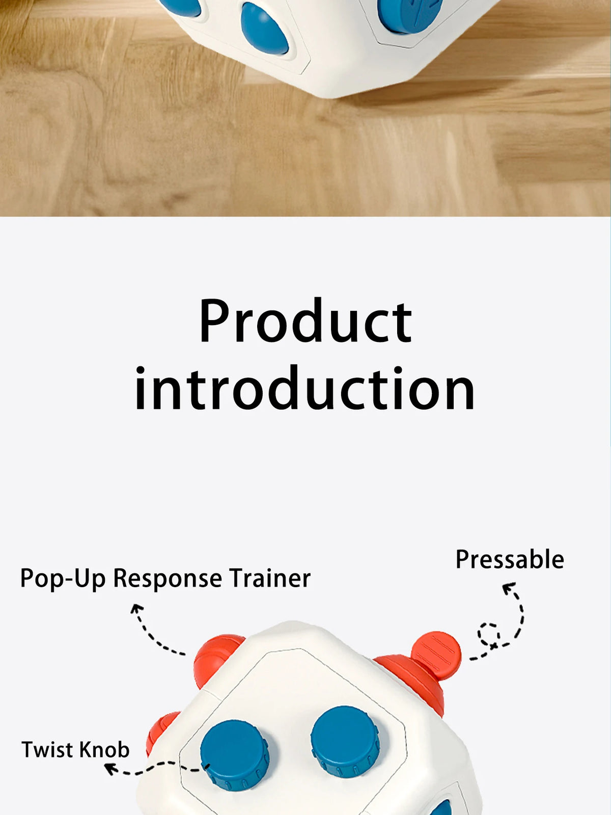 A close-up view of a white sensory trainer with orange accents, showing a twist knob and a pressable feature.
