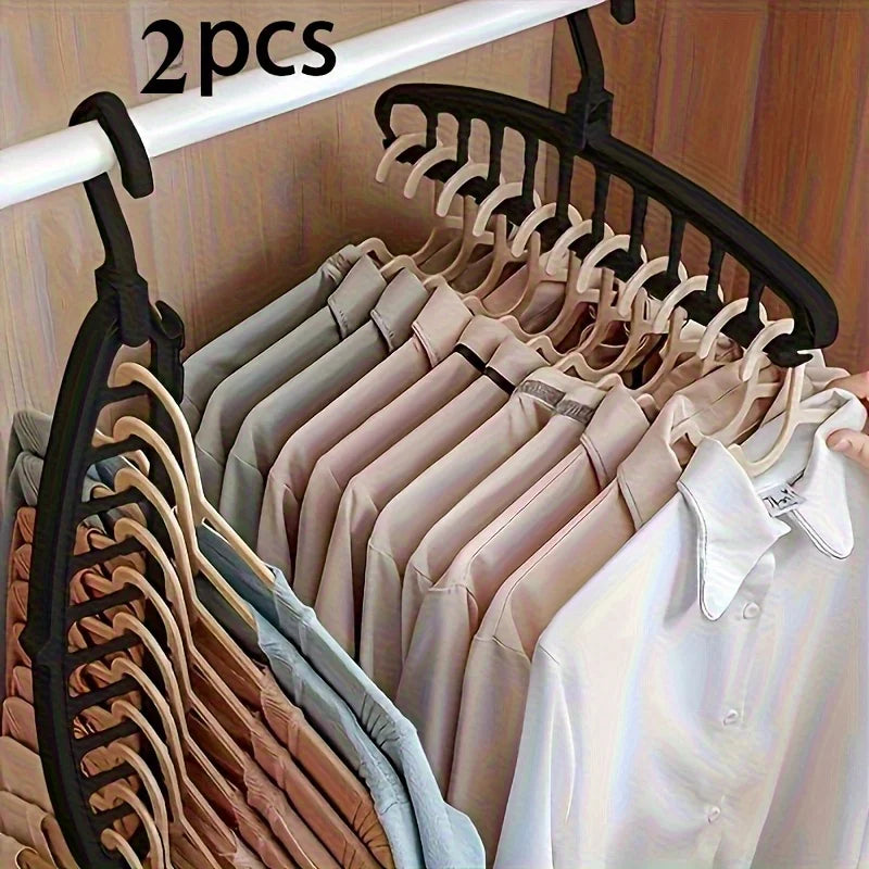 Two hangers are displayed on a black rack, showing various colored shirts and blouses.