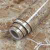 Roll of waterproof self-adhesive marble wallpaper featuring brown and white veining