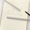 A drawing in a notebook showing a right triangle labeled A, B, and an angle, measured with a metal ruler.