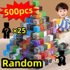A child is holding a large pile of colorful magnetic building blocks and a box labeled 500pcs x25 random set.