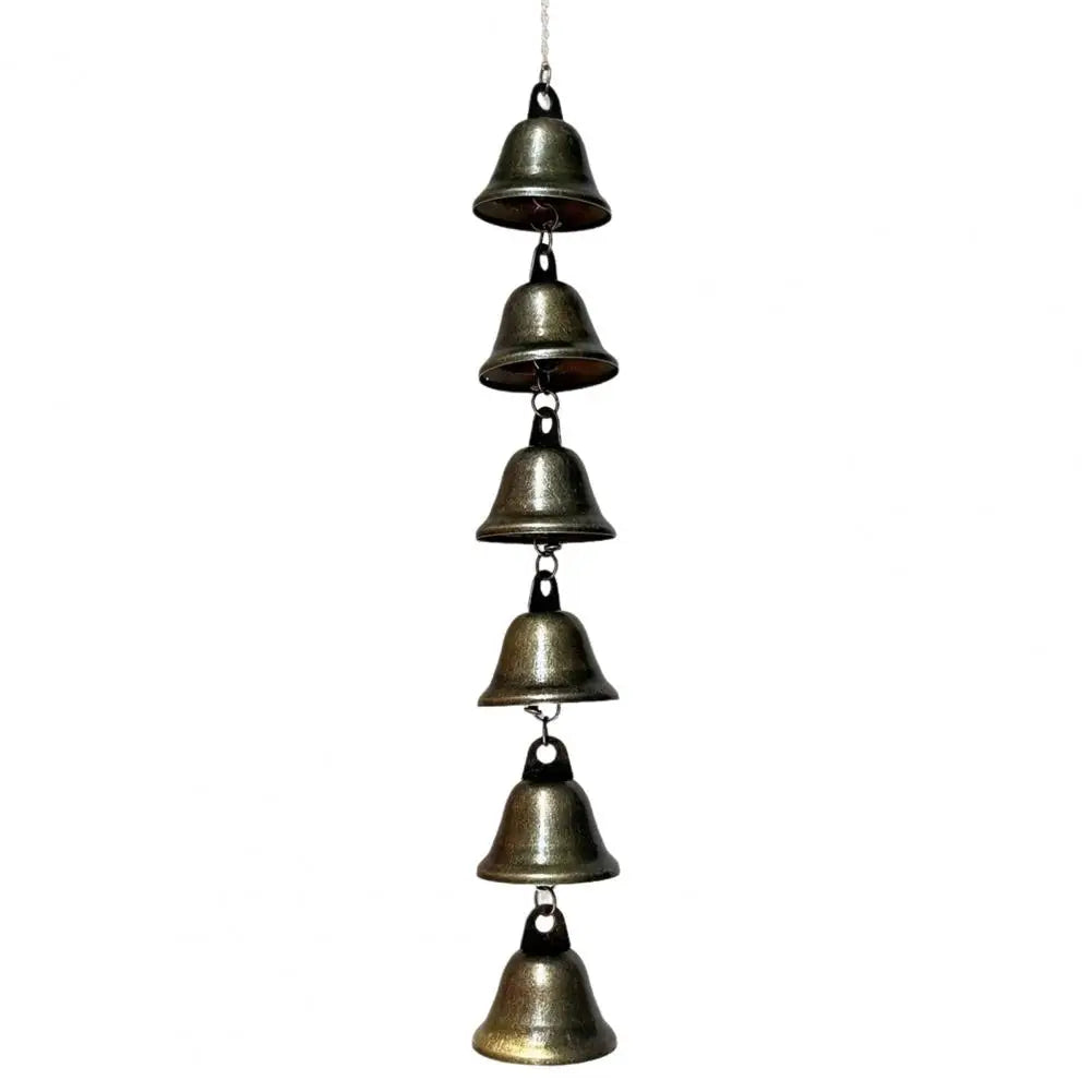 A hanging vintage iron wind chime with multiple bells for outdoor garden decor