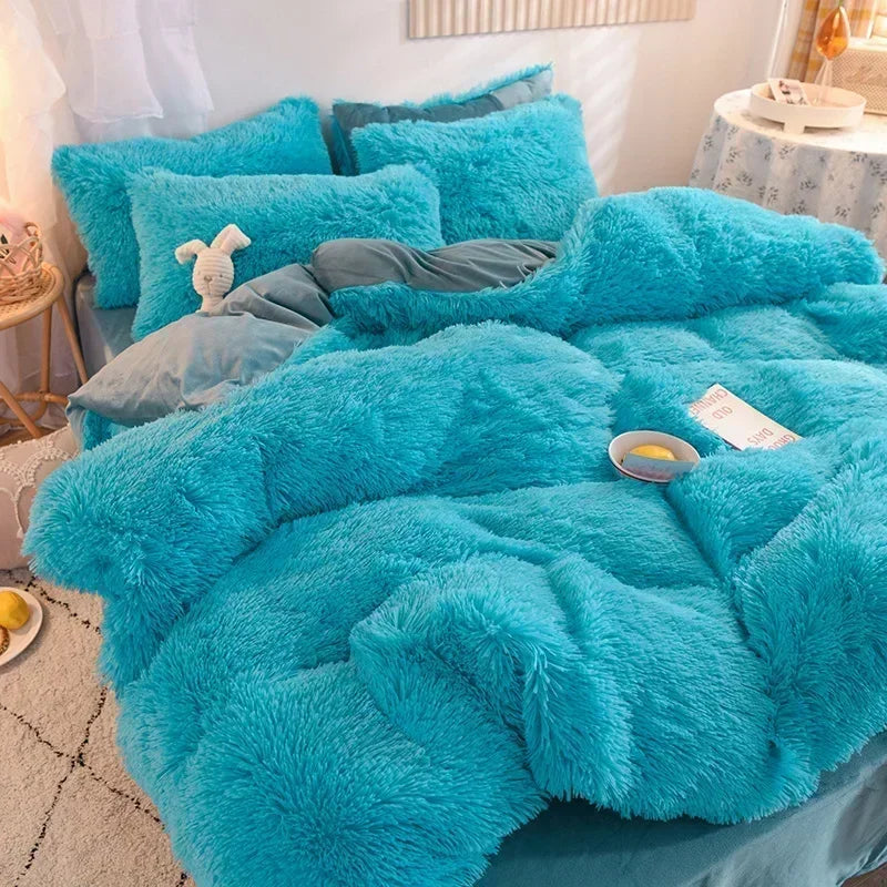A bright turquoise plush mink velvet duvet cover set with matching sheets and pillows on a bed.