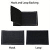 Close-up view of a black hook and loop backing for a tactical morale patch, showing the hook and loop components.