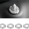 A set of four crystal rhinestone car door lock pull covers displayed against a dark leather surface.