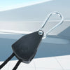 A black tent rope tensioner with a metal hook and cord is shown against a light blue background.