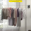 A clothesline displaying various hanging garments, demonstrating a retractable line for drying clothes.