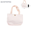 A light pink foldable canvas tote bag with beige straps and a small black pouch shown from the front.