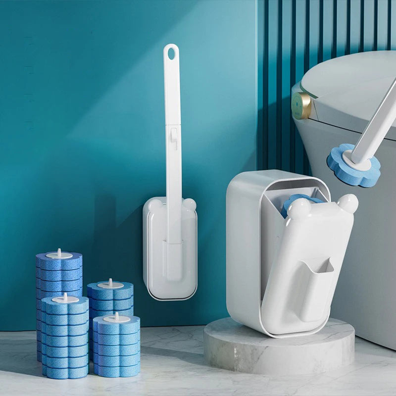 A white wall-mounted disposable toilet brush set with a long handle and replaceable heads displayed on a marble surface.