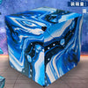 A blue and white marbled magnetic fidget cube puzzle shown from an angle against a starry background.