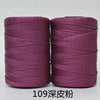 Two spools of magenta 3-ply polyester knitting yarn for crochet and hand crafts