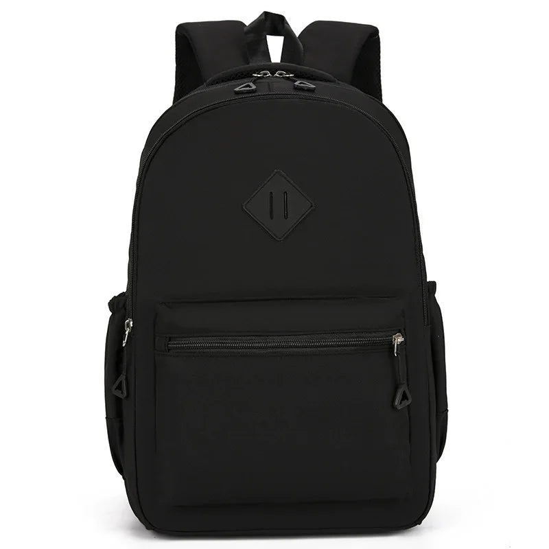 Black urban nylon backpack with a flap closure and a zippered pocket.
