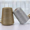 Two spools of metallic silver shimmer crochet yarn for knitting and macrame