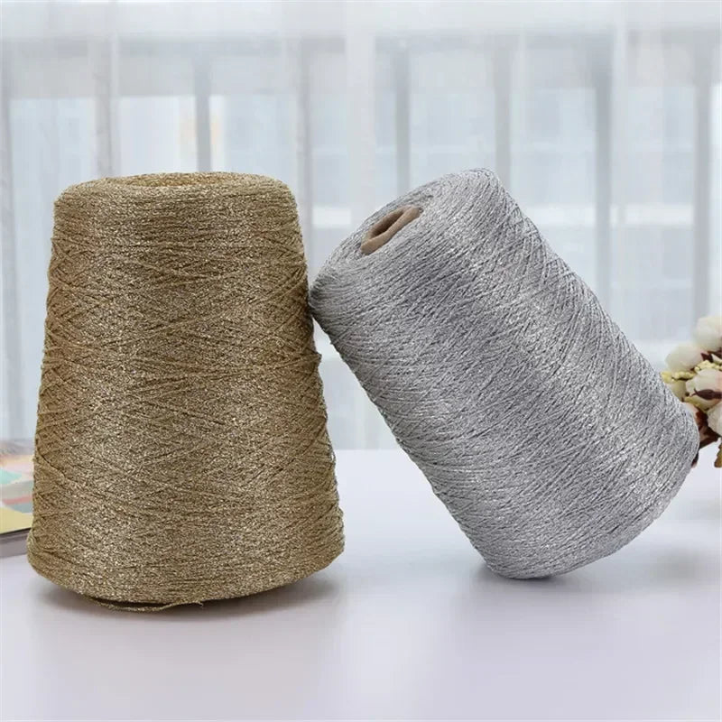Two spools of metallic silver shimmer crochet yarn for knitting and macrame