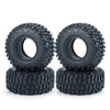 A pair of black rubber mud terrain tires stacked on top of each other.