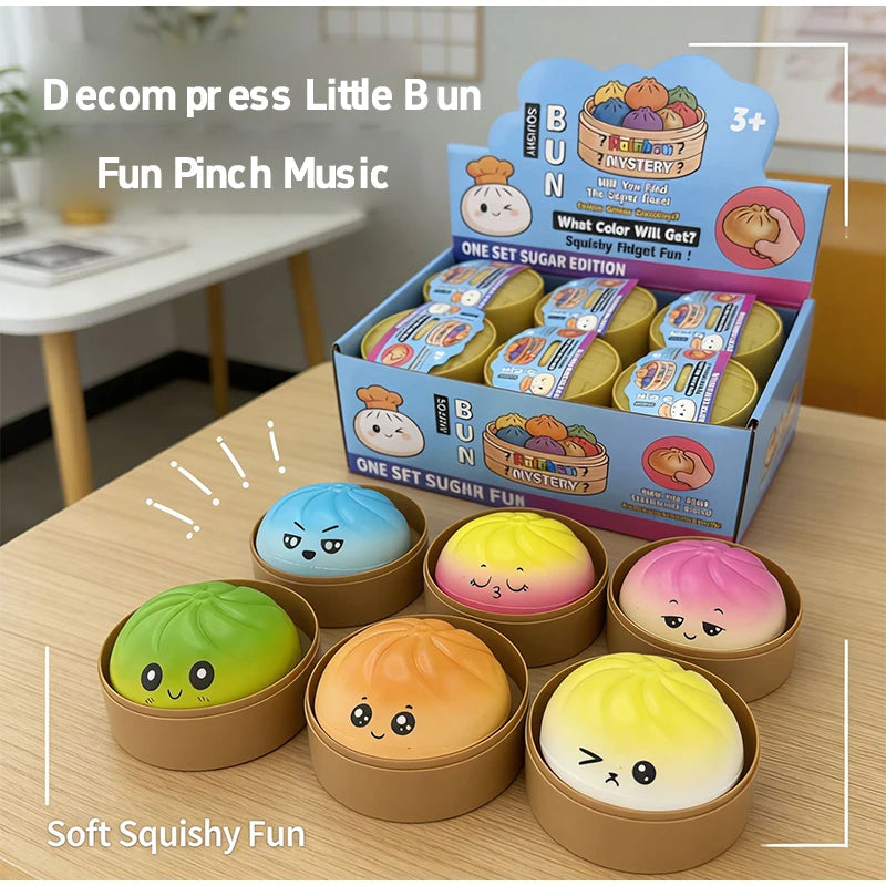 A set of soft squishy fun music toys in various colors and shapes displayed on a wooden table.