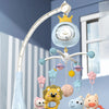 A baby crib mobile with a projector, night light, and remote control featuring animal figures hanging from a curved arm.