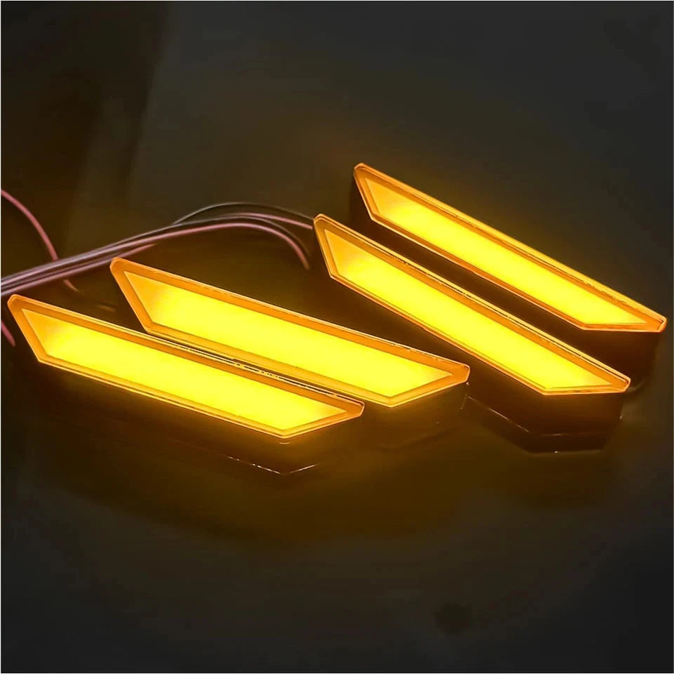 A set of amber LED grille lights for a Ford Ranger Raptor, shown illuminated against a dark background.