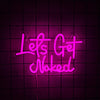 Neon sign spelling out Lets Get Naked in bright pink glowing script against a dark grid background