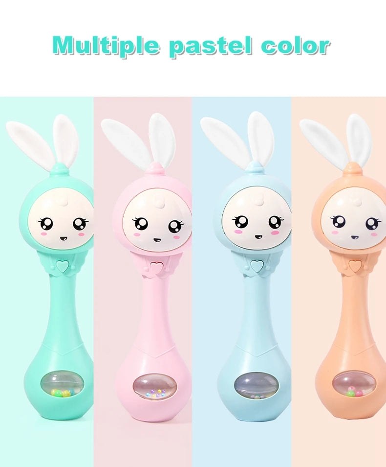 Multiple pastel color musical rabbit baby rattle and teether toys shown in various shades of mint green, pink, and peach.