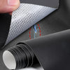 A hand is peeling off a piece of gray self-adhesive leather repair tape, showing a small tear in the material.