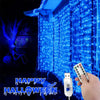 Blue LED curtain lights with remote illuminating a building facade for Halloween decoration