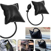 Black inflatable air wedge tool used for repairing car doors and windows.