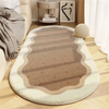 A beige and white decorative area rug with striped patterns in shades of brown and cream on a wooden floor.