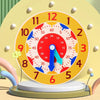 A wooden clock face with colorful markers and hands is displayed on a stand for educational learning.