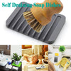 A set of self-draining soap dishes featuring wooden scrub brushes with natural sisal bristles for dish cleaning.