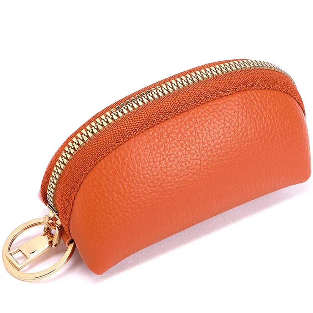 Orange PU leather key organizer wallet with a gold zipper and attached keyring
