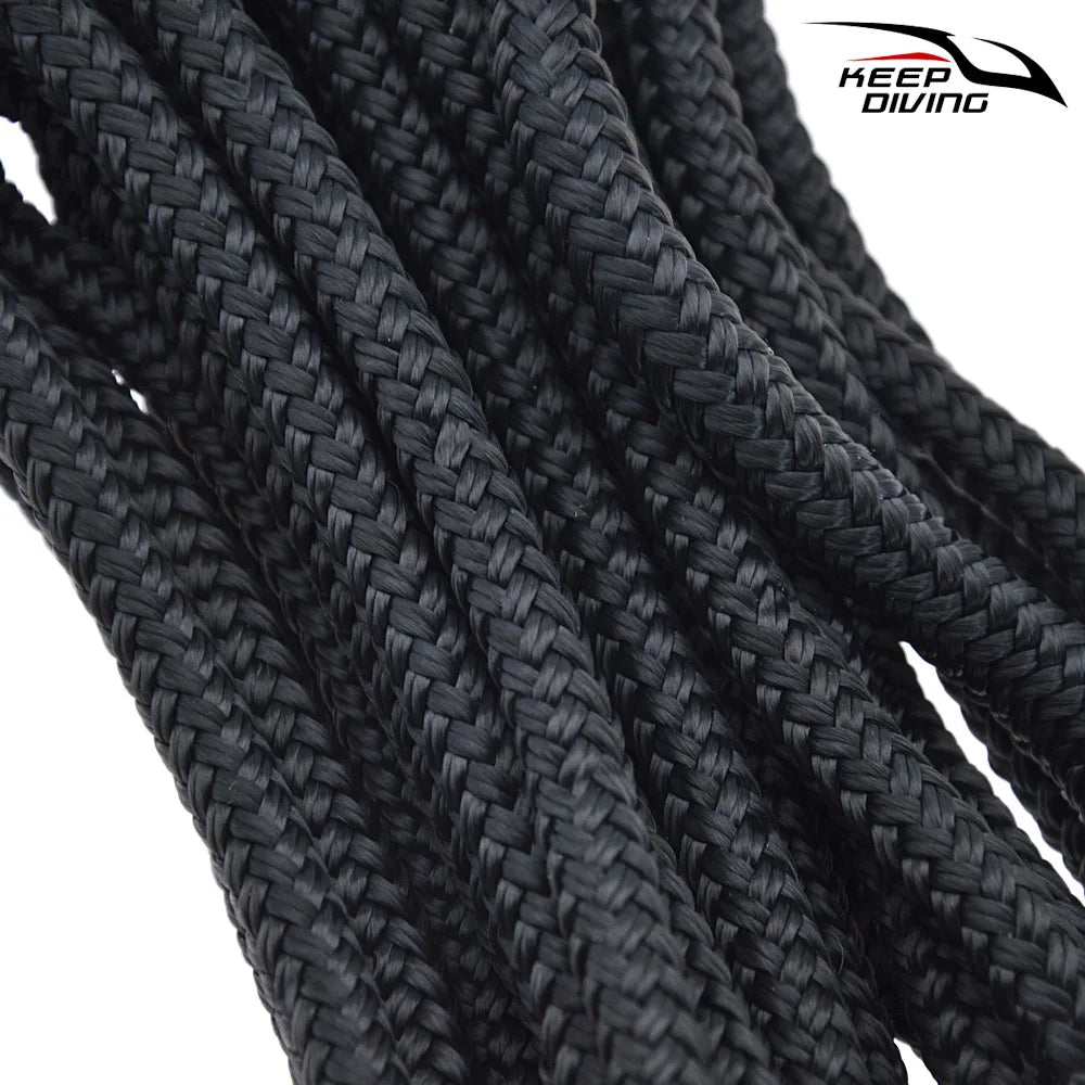 Close-up of black double braid nylon dock lines coiled together.