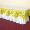 Elegant ice silk table skirt with matching top swag in white and gold fabric.